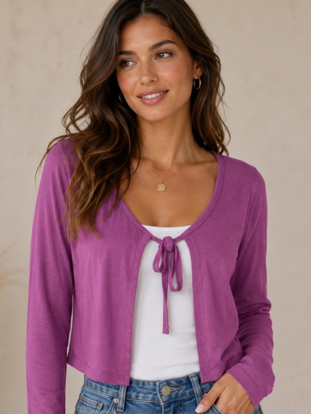 Soft feel long sleeve sweater with a tie-front neck, perfect for layering.